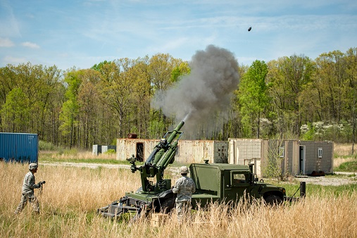 105mm Hawkeye howitzer firing from an AM General HMMWV